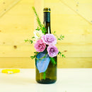 Espuma floral OASIS® Deluxe sobre base plástica, con sistema de fijación fácil “desprenda y pegue” y perforaciones laterales para soporte extra. Caja con 12 piezas, 2.5 cm de ancho y 5 cm de diámetro