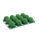 Minideco de espuma floral OASIS® Deluxe sobre una base plástica. En presentación de 12 piezas. • En la base cuenta con sistema de “desprenda y pegue” que hace que se fije fácilmente en cualquier superficie. Además, de que el minideco tiene dos perforaciones laterales como soporte extra.